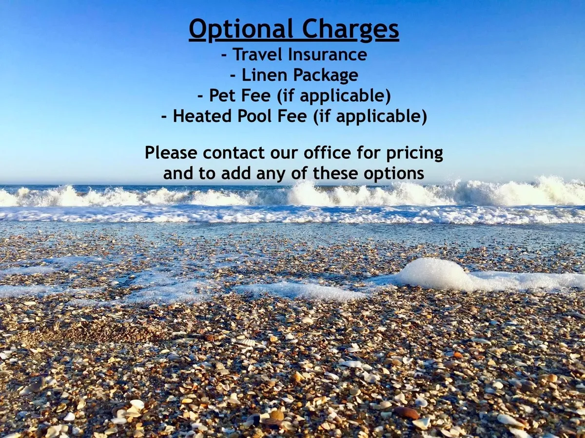 A picturesque stretch of North Topsail Beach with soft sand dotted with seashells and gentle waves rolling onto the shore. The relaxed, open scene is ideal for family-friendly beach activities, like building sandcastles and wading in the surf.